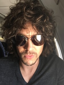 Gooding traveling in an airplane