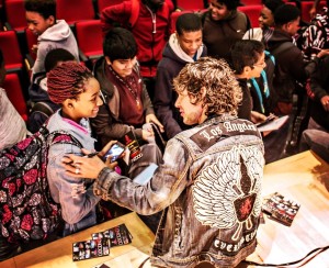 Gooding greeting young students